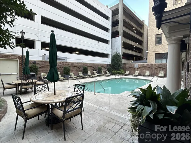 a view of a chairs and table in the patio