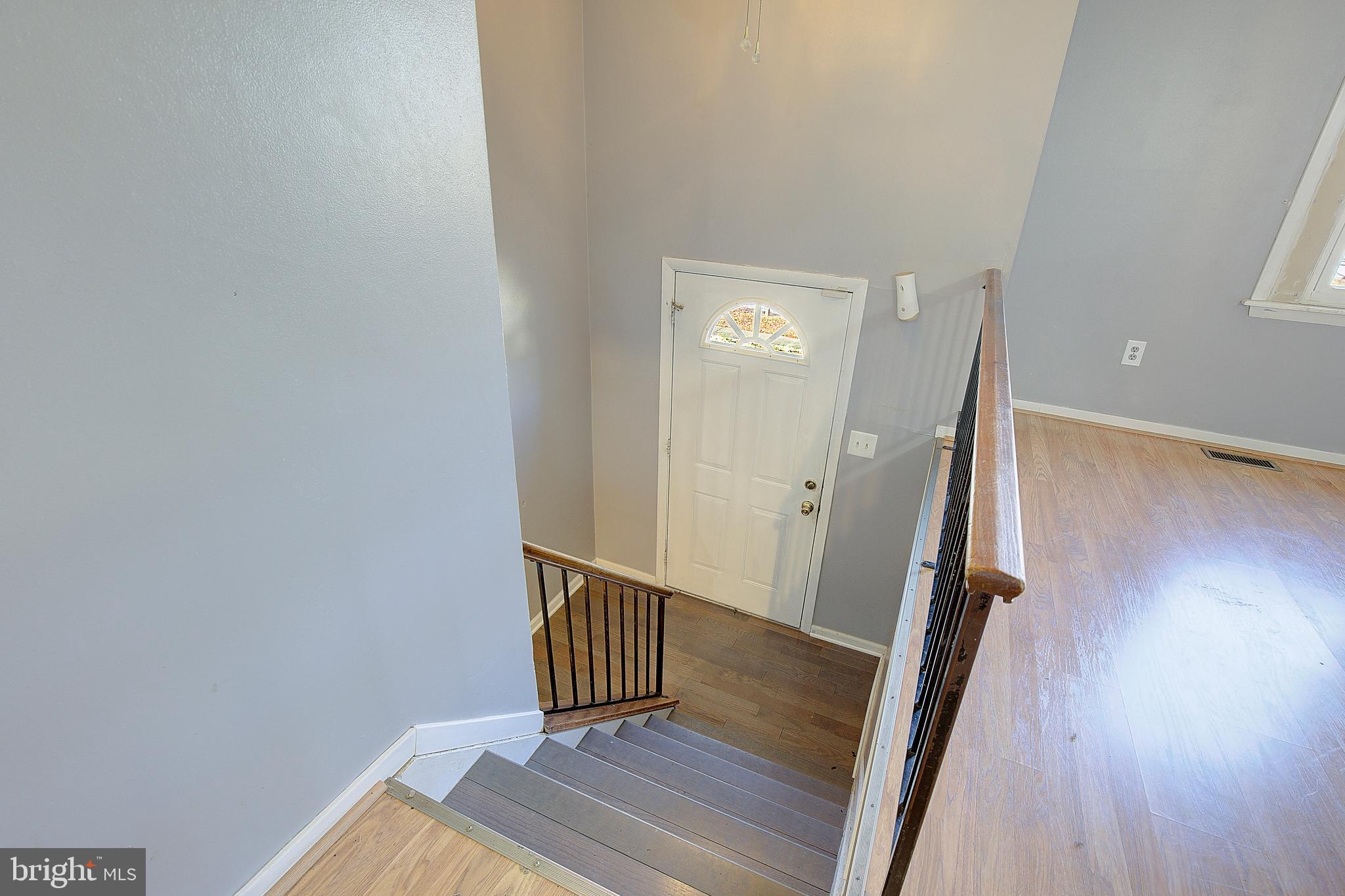 3611 Blackwater Road Clinton, MD 20735 - Photo 14 of 31 a view of a hallway with wooden floor and staircase