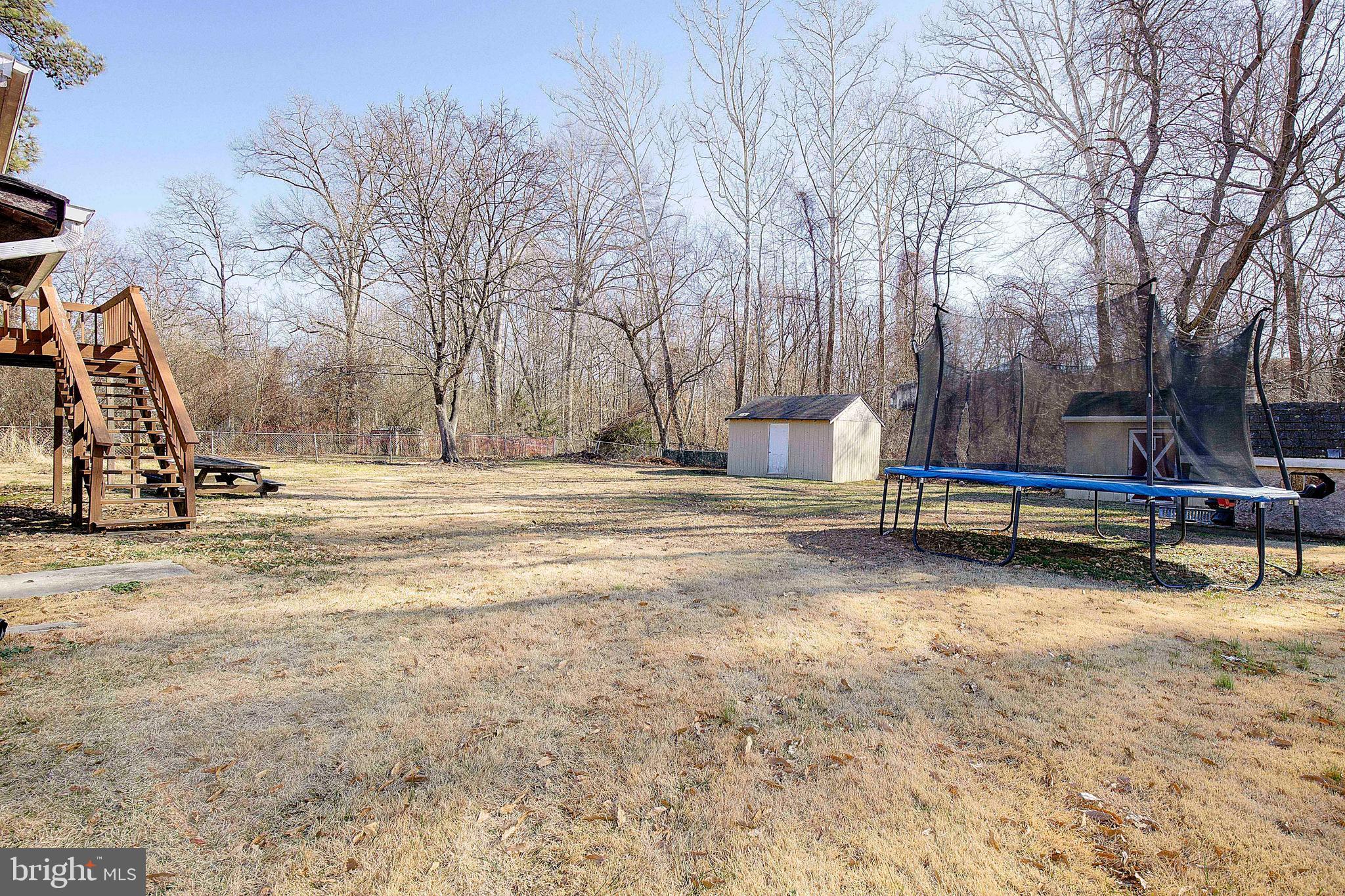 3611 Blackwater Road Clinton, MD 20735 - Photo 28 of 31 a backyard of a house with barbeque oven