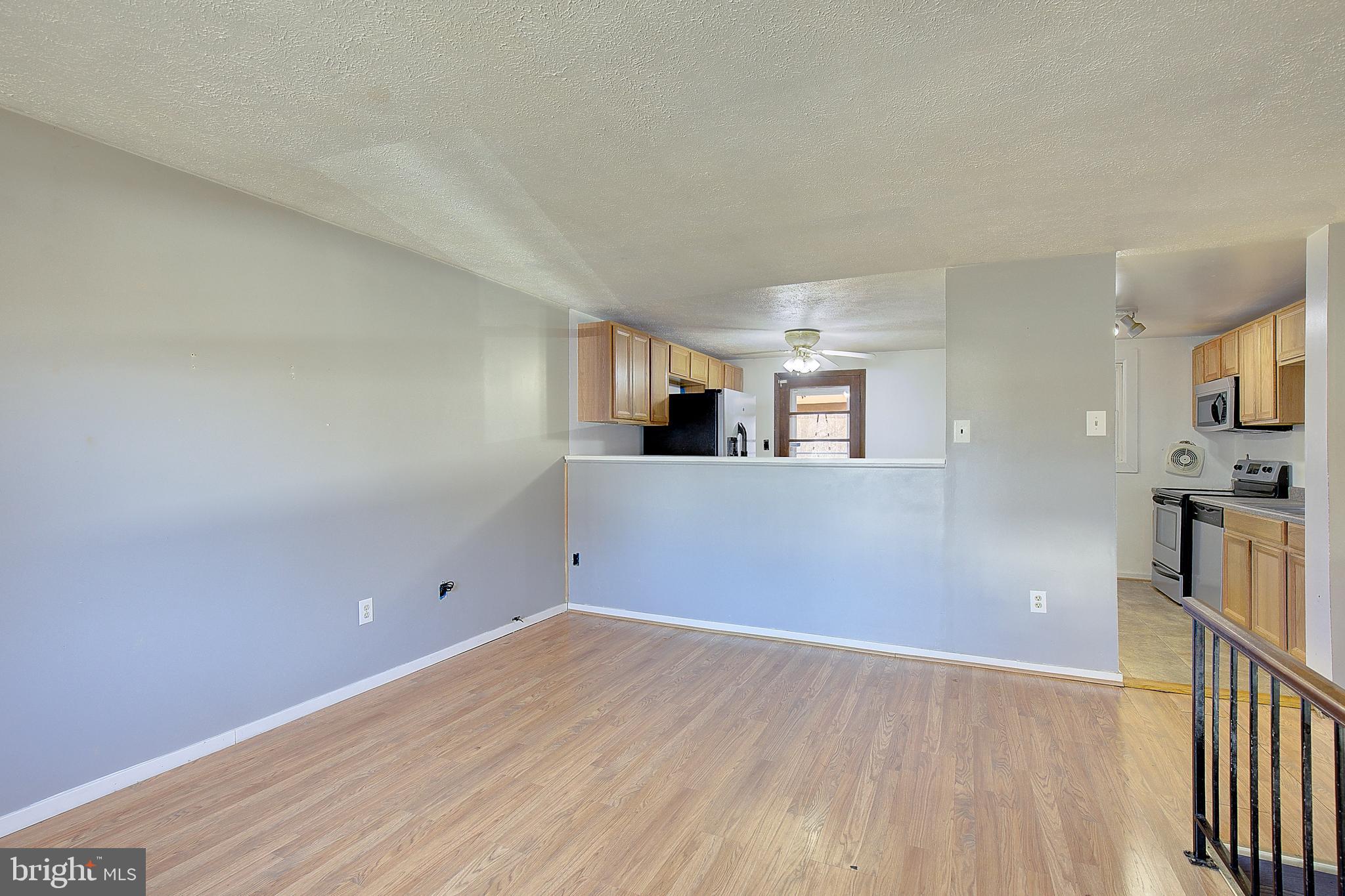 3611 Blackwater Road Clinton, MD 20735 - Photo 5 of 31 a view of a kitchen with wooden floor and cabinets