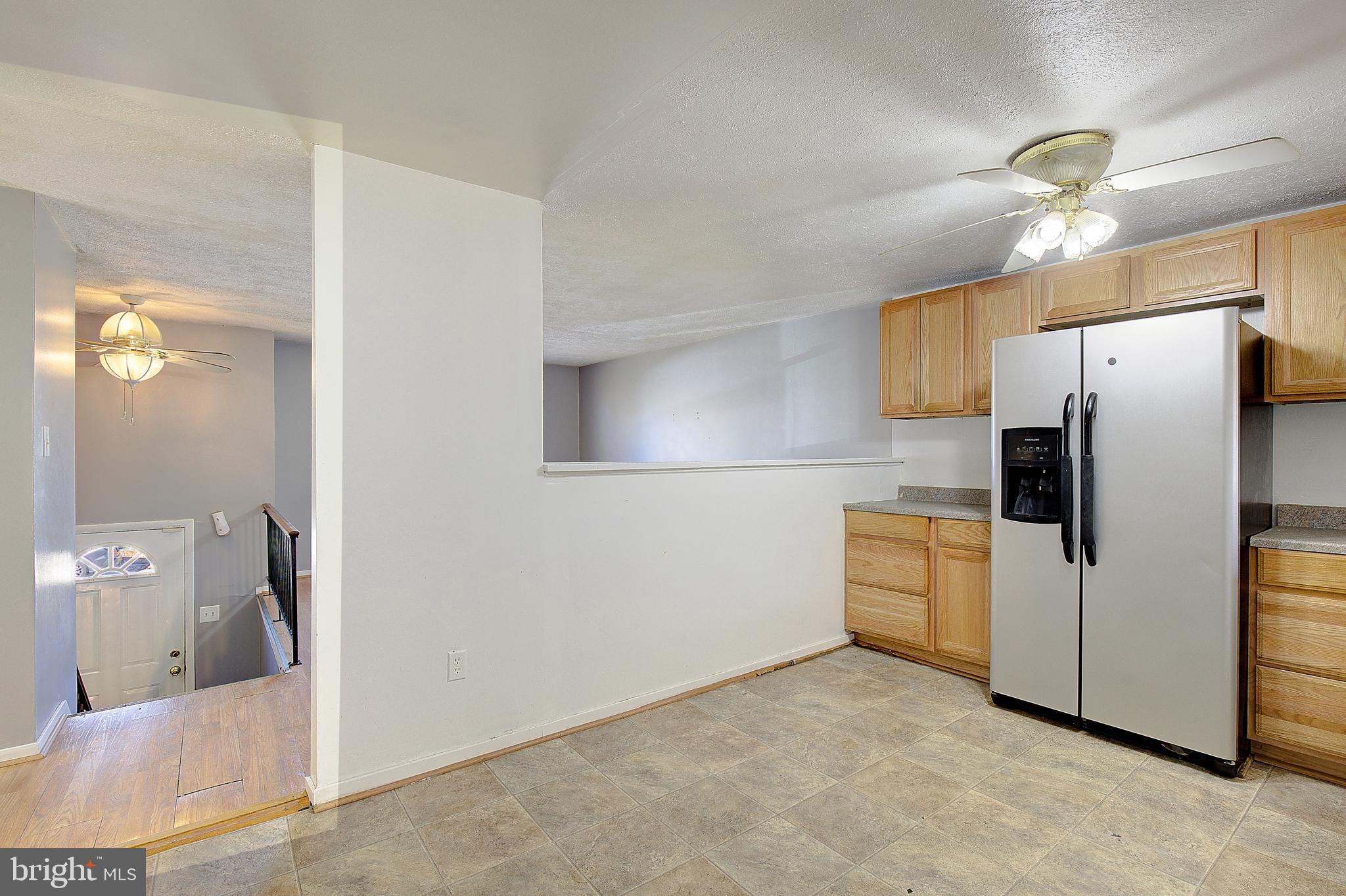 3611 Blackwater Road Clinton, MD 20735 - Photo 9 of 31 a kitchen with stainless steel appliances a refrigerator and microwave