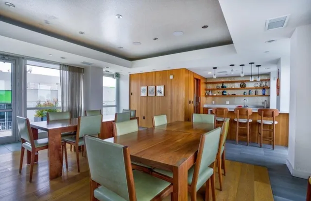 a view of a dining room with furniture window and wooden floor