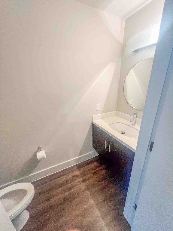 1101 Grove Boulevard, Unit 701 Austin, TX 78741 - Photo 10 of 16 a bathroom with a sink a toilet and a mirror