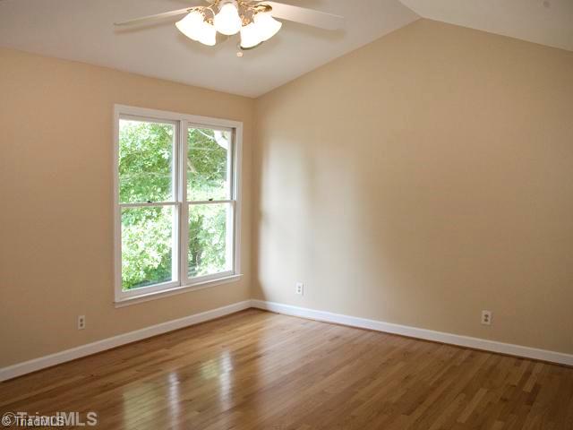 5811 Billet Road Oak Ridge, NC 27310 - Photo 12 of 16 2nd Bedroom. One of three other second level bedrooms, all feature great closets, good size rooms, neutral decor, and gleaming hardwoods! This one has a private bath. There are three full baths on the second level.