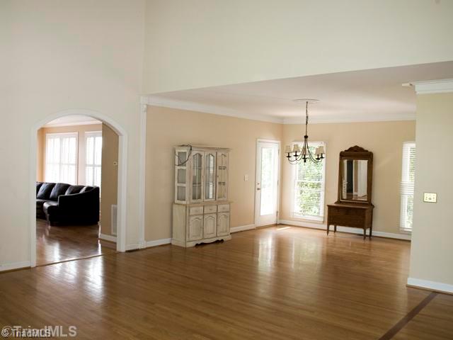 5811 Billet Road Oak Ridge, NC 27310 - Photo 7 of 16 Dining Room. The open dining area expands for entertaining into the vaulted great room.
