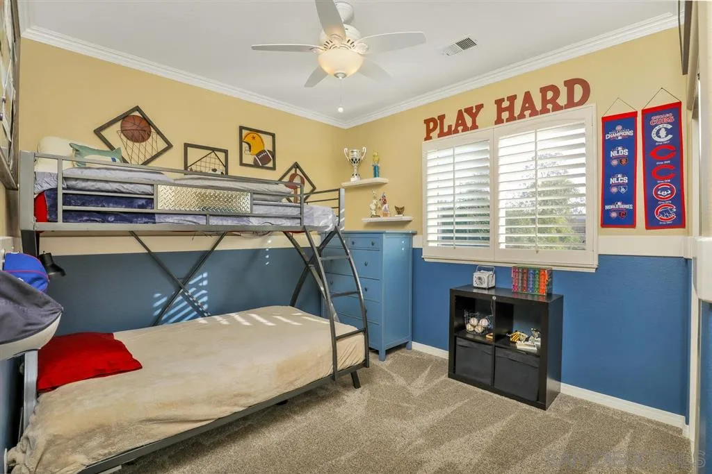 16691 Deer Ridge Road San Diego, CA 92127 - Photo 14 of 20 a bedroom with a bed and a table