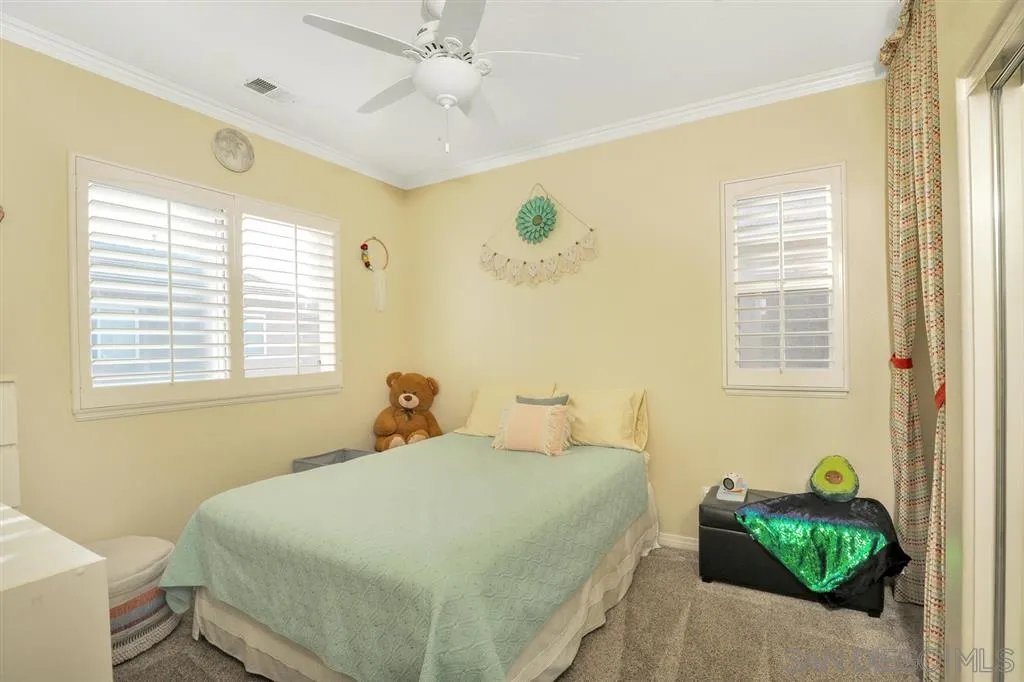16691 Deer Ridge Road San Diego, CA 92127 - Photo 15 of 20 a bedroom with a bed and a window