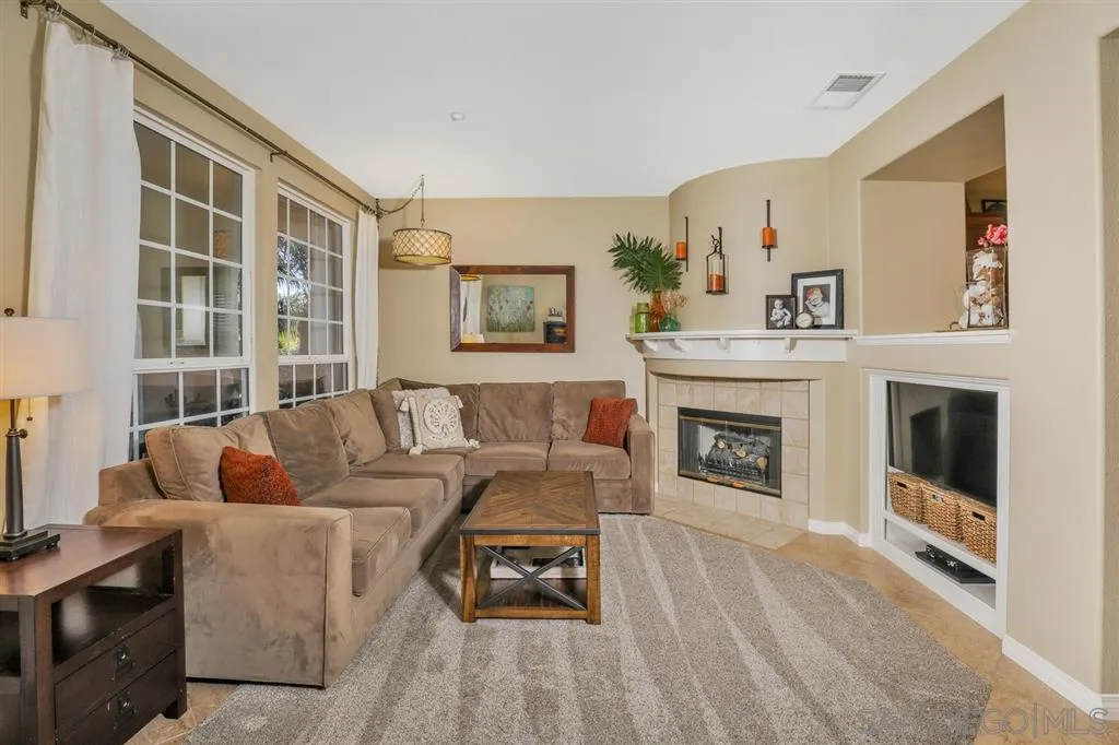 16691 Deer Ridge Road San Diego, CA 92127 - Photo 2 of 20 a living room with furniture and a fireplace