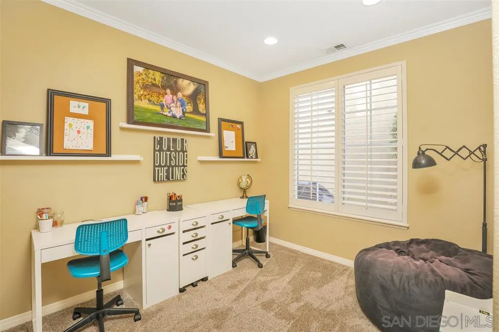 16691 Deer Ridge Road San Diego, CA 92127 - Photo 8 of 20 a view of a livingroom with workspace and a window