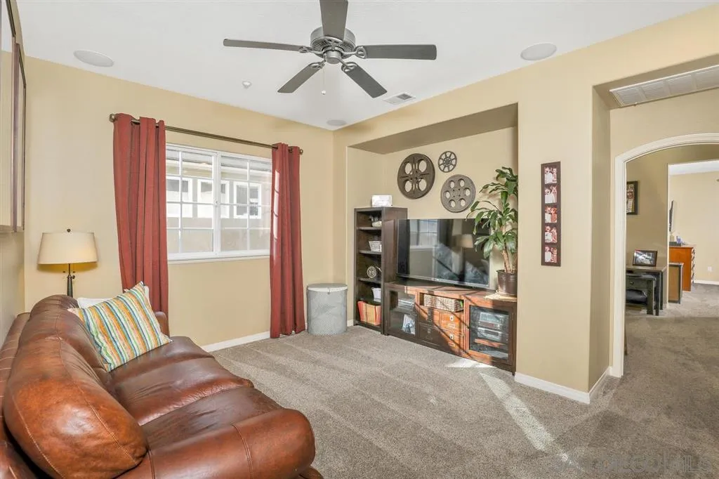 16691 Deer Ridge Road San Diego, CA 92127 - Photo 9 of 20 a bedroom with furniture and a flat screen tv
