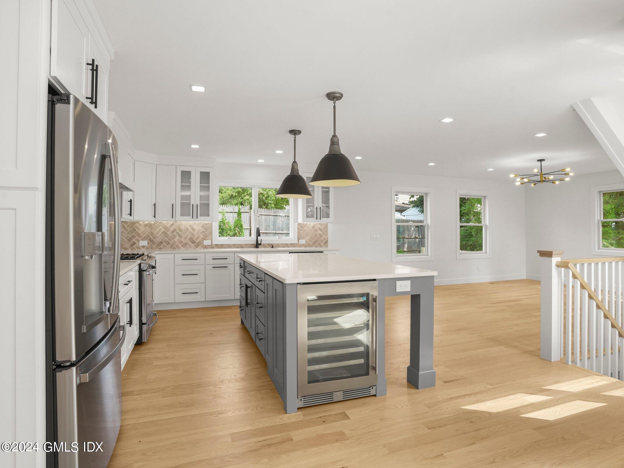 14 Rockland Place Greenwich, CT 06831 - Photo 14 of 54 a kitchen with stainless steel appliances kitchen island granite countertop a refrigerator a sink and a stove