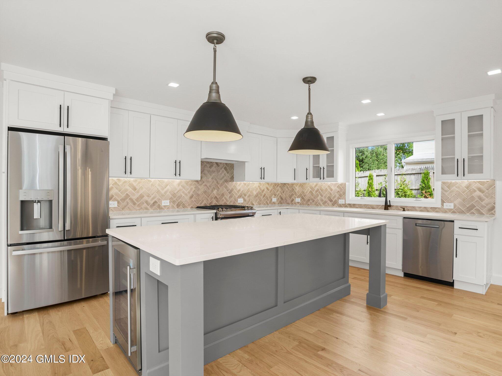 14 Rockland Place Greenwich, CT 06831 - Photo 15 of 54 a kitchen with stainless steel appliances a sink stove and refrigerator