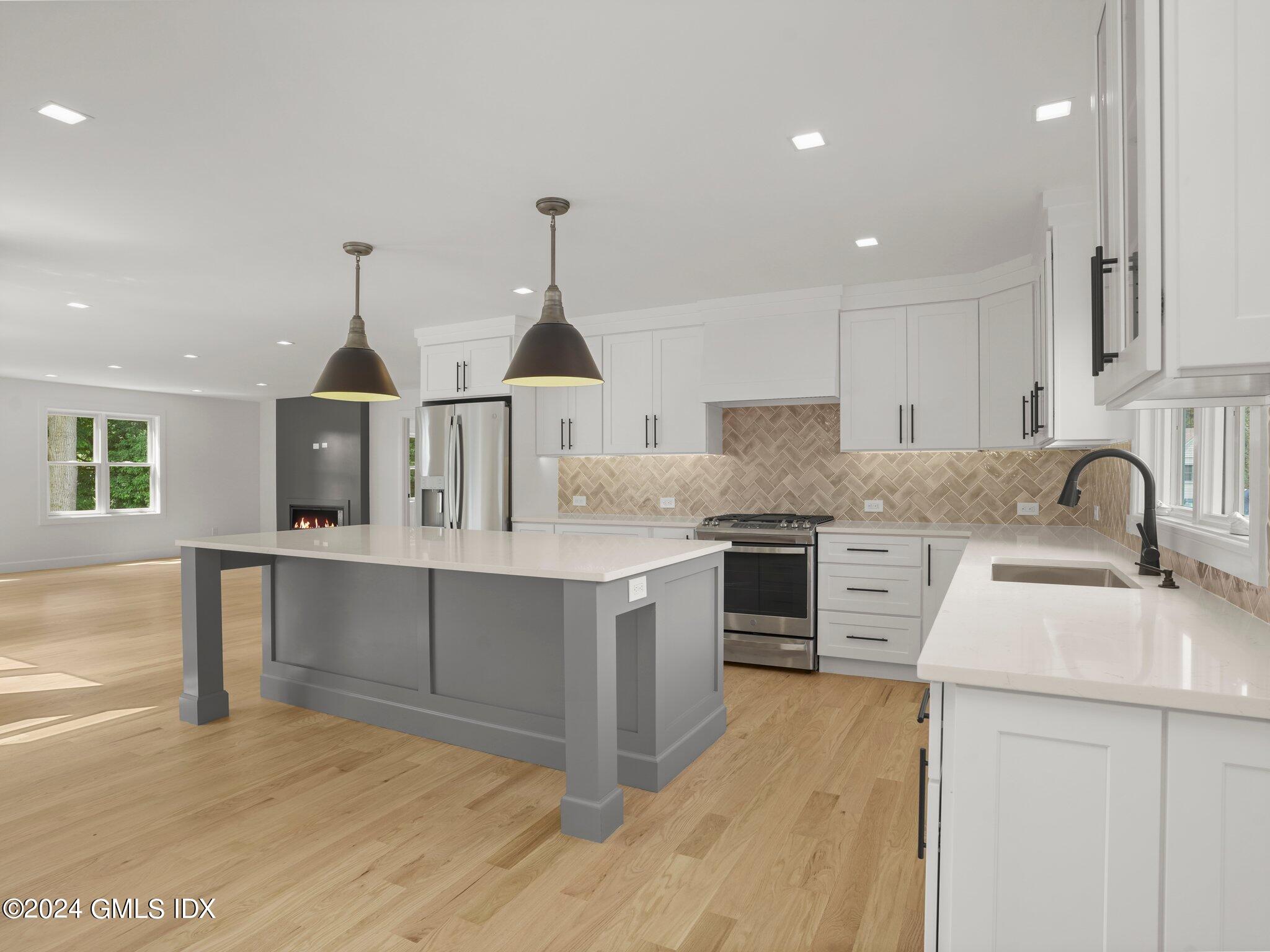 14 Rockland Place Greenwich, CT 06831 - Photo 17 of 54 a kitchen with counter top space cabinets and stainless steel appliances