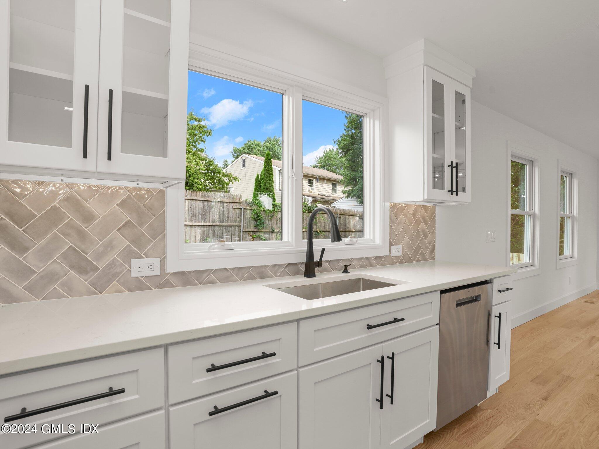 14 Rockland Place Greenwich, CT 06831 - Photo 21 of 54 a kitchen with cabinets and window