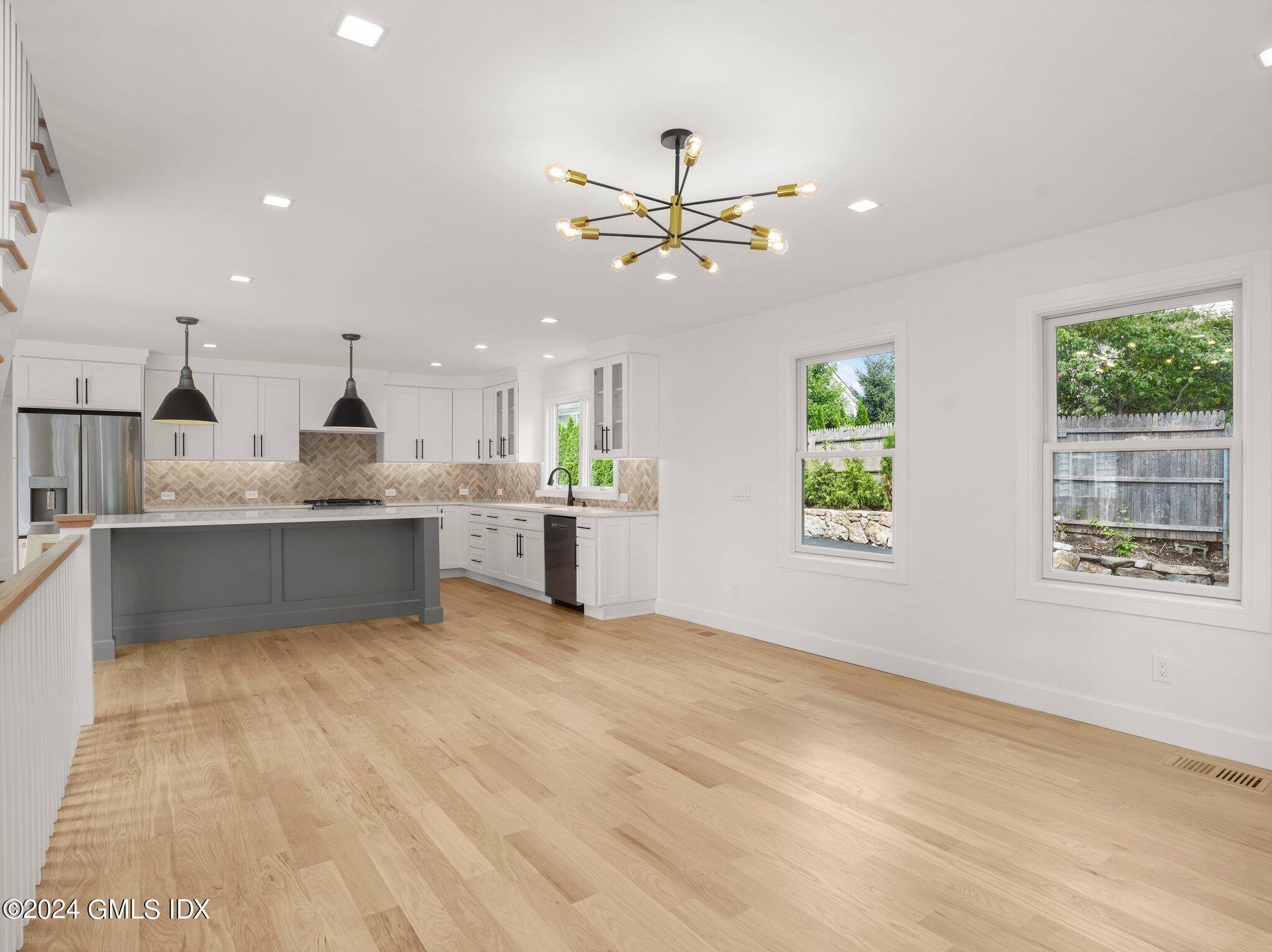 14 Rockland Place Greenwich, CT 06831 - Photo 24 of 54 a view of kitchen with stainless steel appliances kitchen island a sink dishwasher a stove and a refrigerator with wooden floor