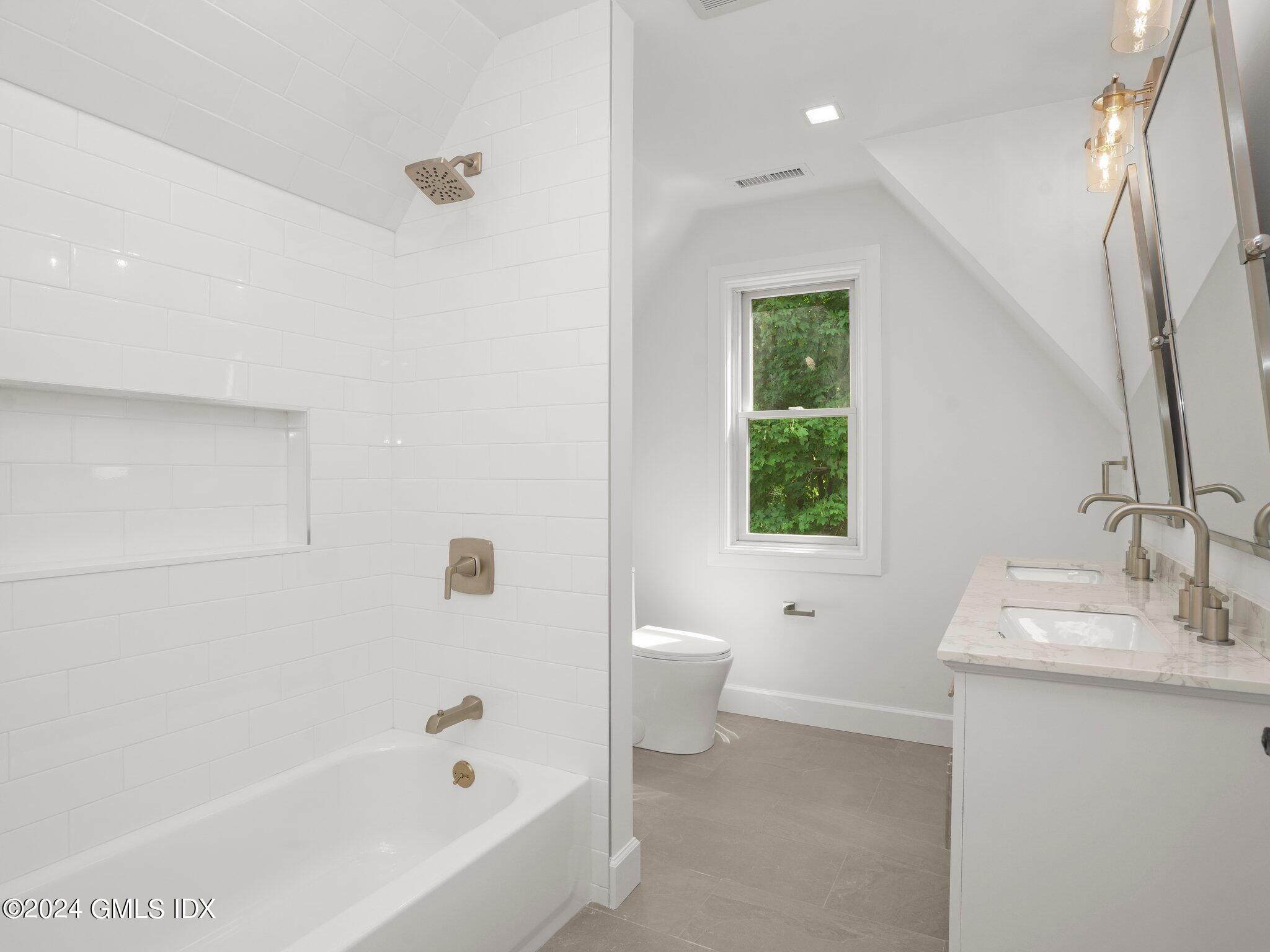 14 Rockland Place Greenwich, CT 06831 - Photo 26 of 54 a bathroom with a bathtub sink and toilet