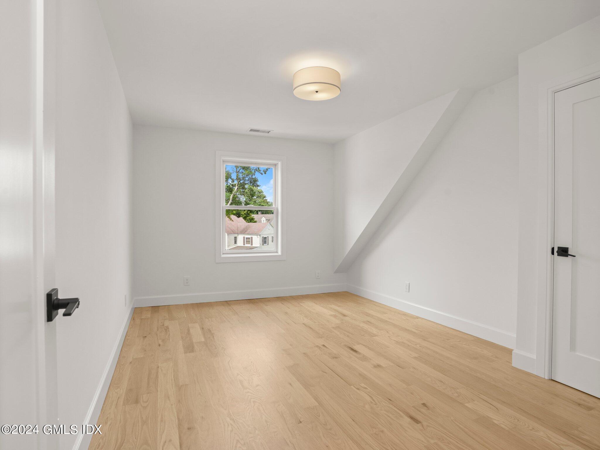 14 Rockland Place Greenwich, CT 06831 - Photo 29 of 54 an empty room with windows