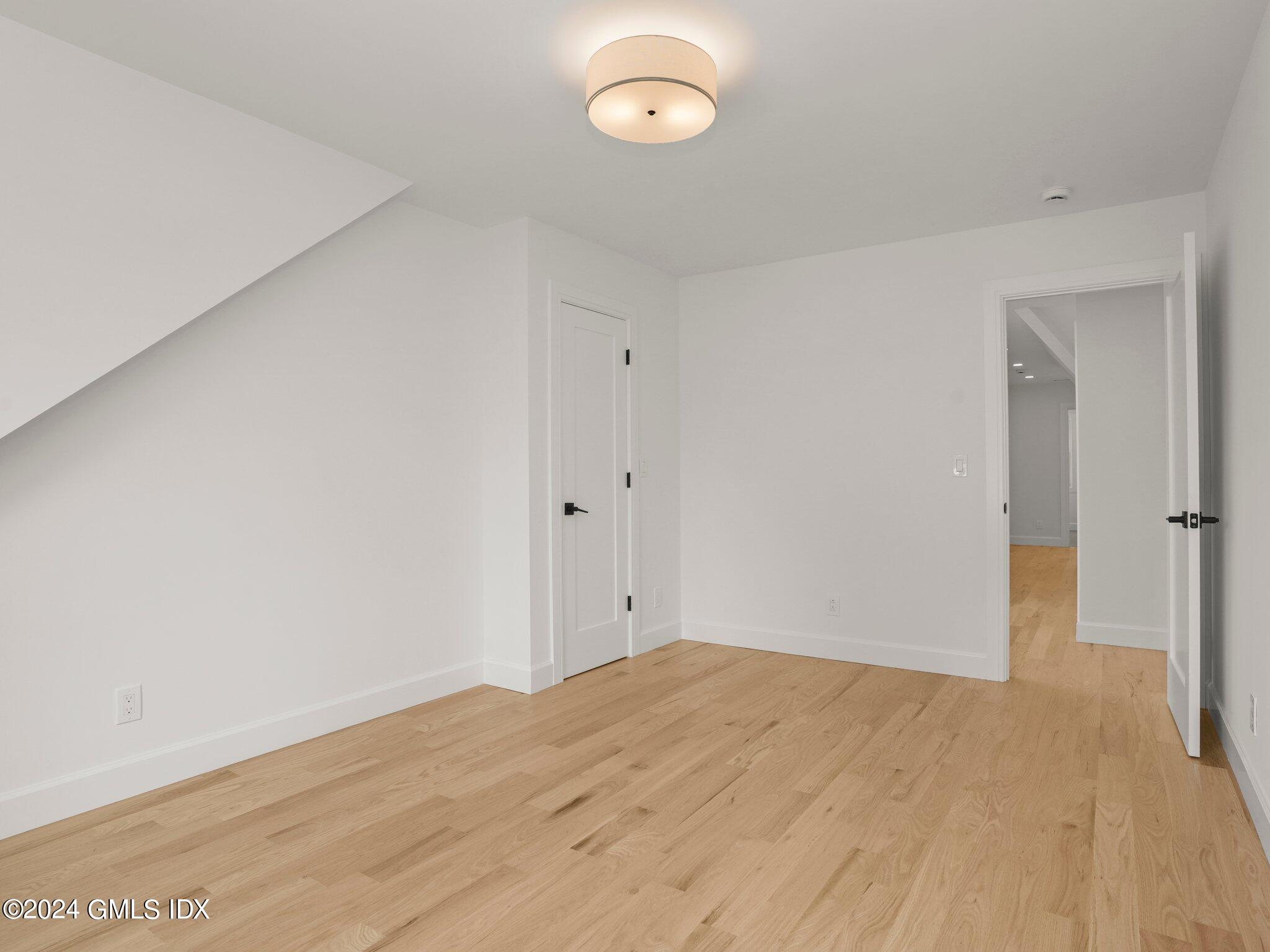 14 Rockland Place Greenwich, CT 06831 - Photo 30 of 54 a view of empty room with wooden floor