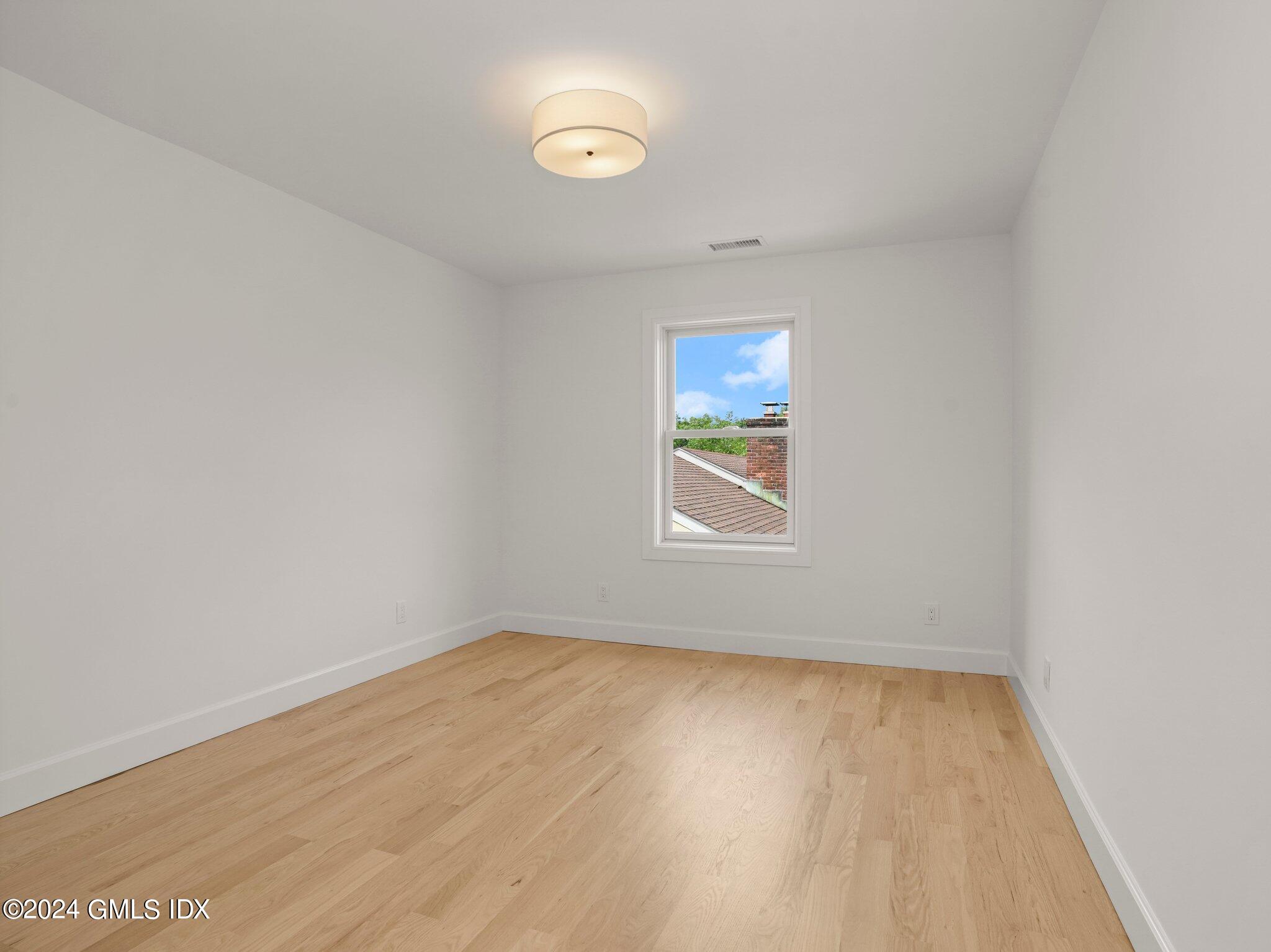14 Rockland Place Greenwich, CT 06831 - Photo 32 of 54 an empty room with a window