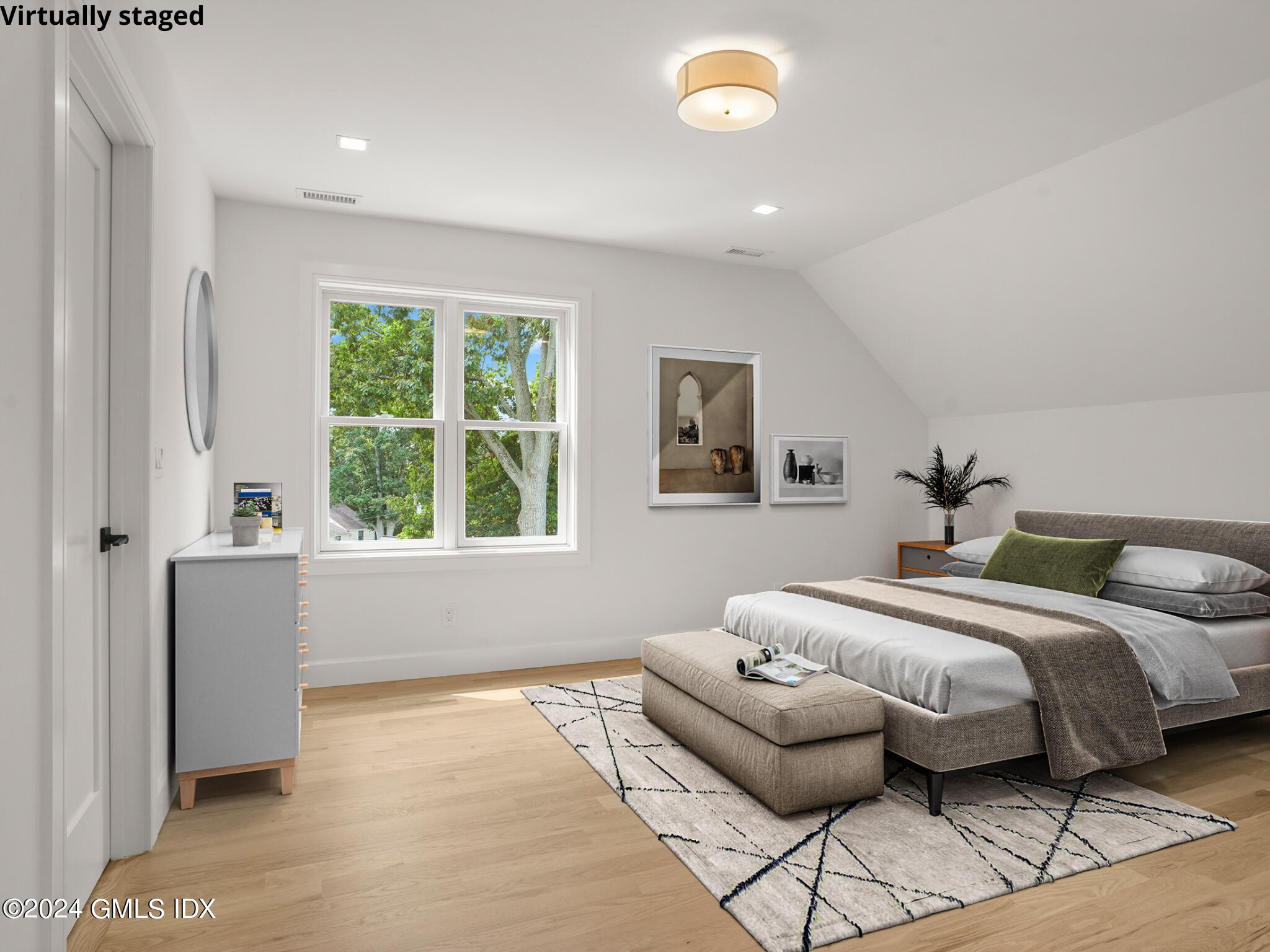 14 Rockland Place Greenwich, CT 06831 - Photo 36 of 54 a bedroom with a bed and a large window