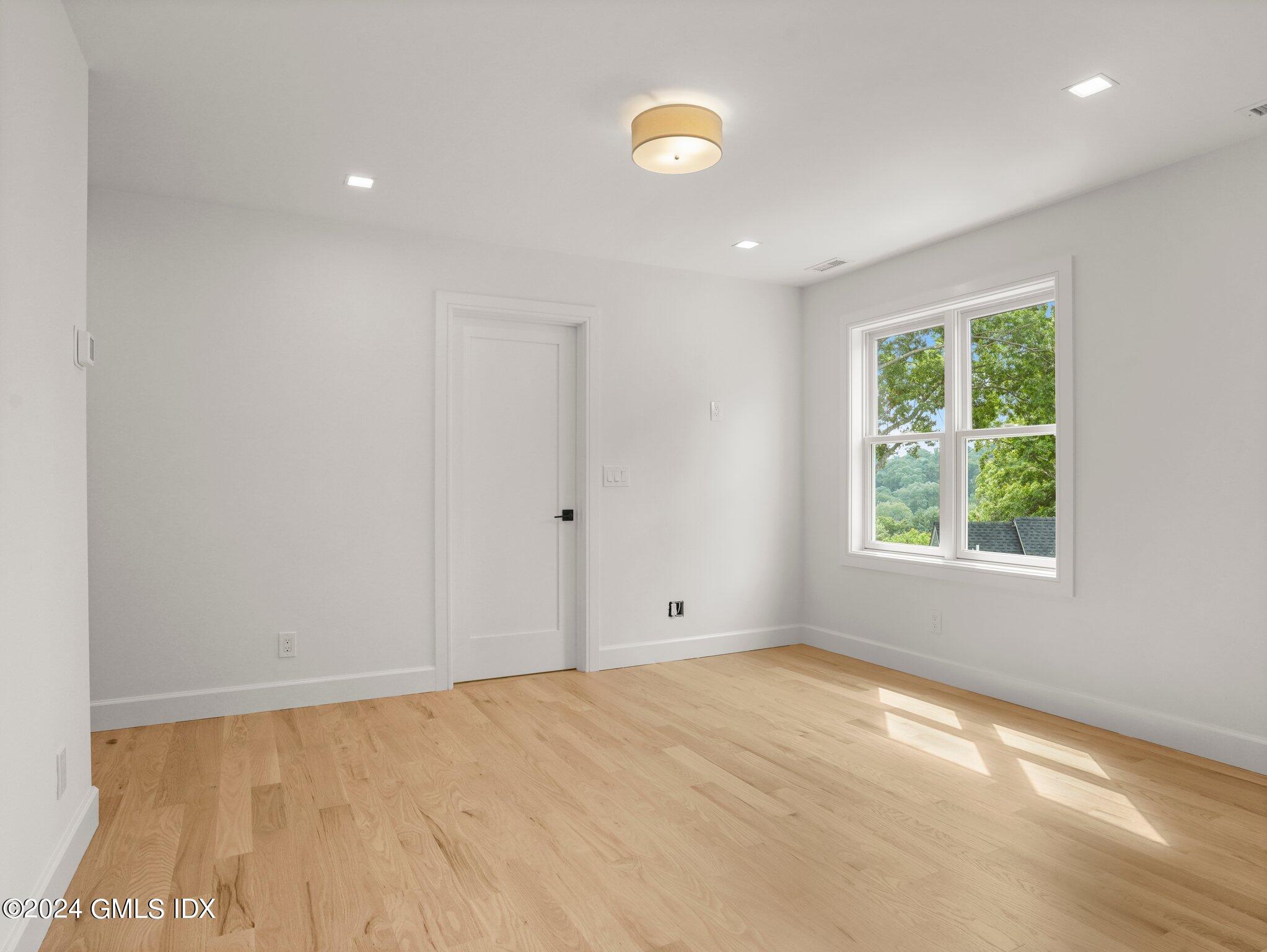 14 Rockland Place Greenwich, CT 06831 - Photo 37 of 54 a view of an empty room with a window