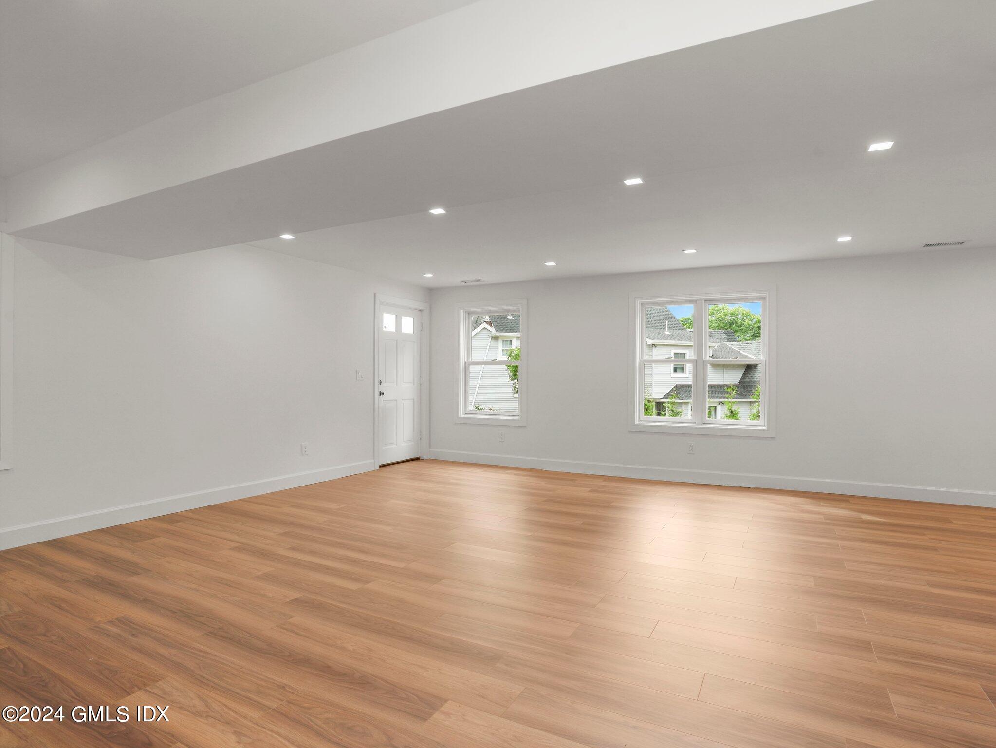 14 Rockland Place Greenwich, CT 06831 - Photo 43 of 54 an empty room with wooden floor and window