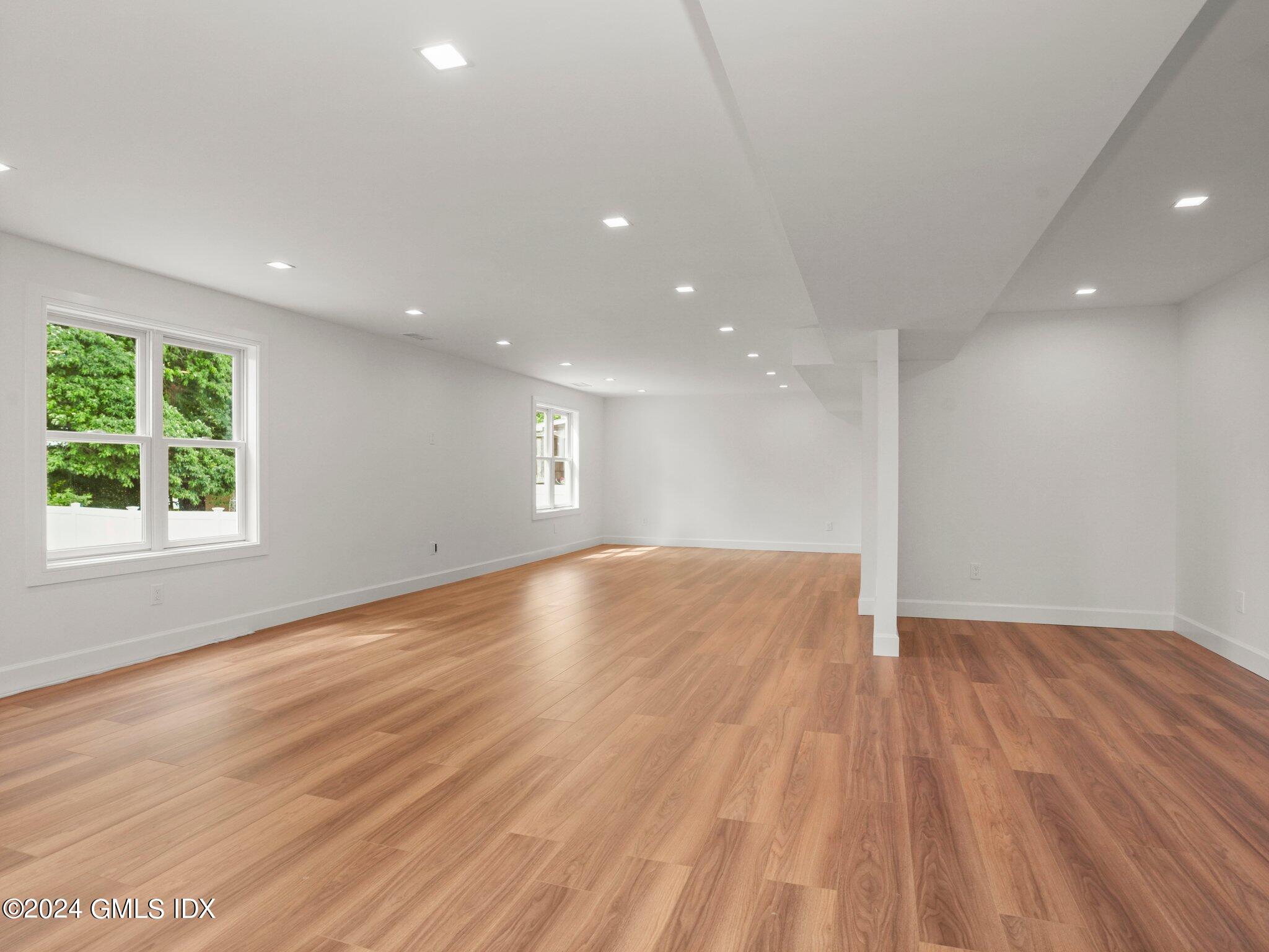 14 Rockland Place Greenwich, CT 06831 - Photo 44 of 54 a view of empty room with wooden floor and fan
