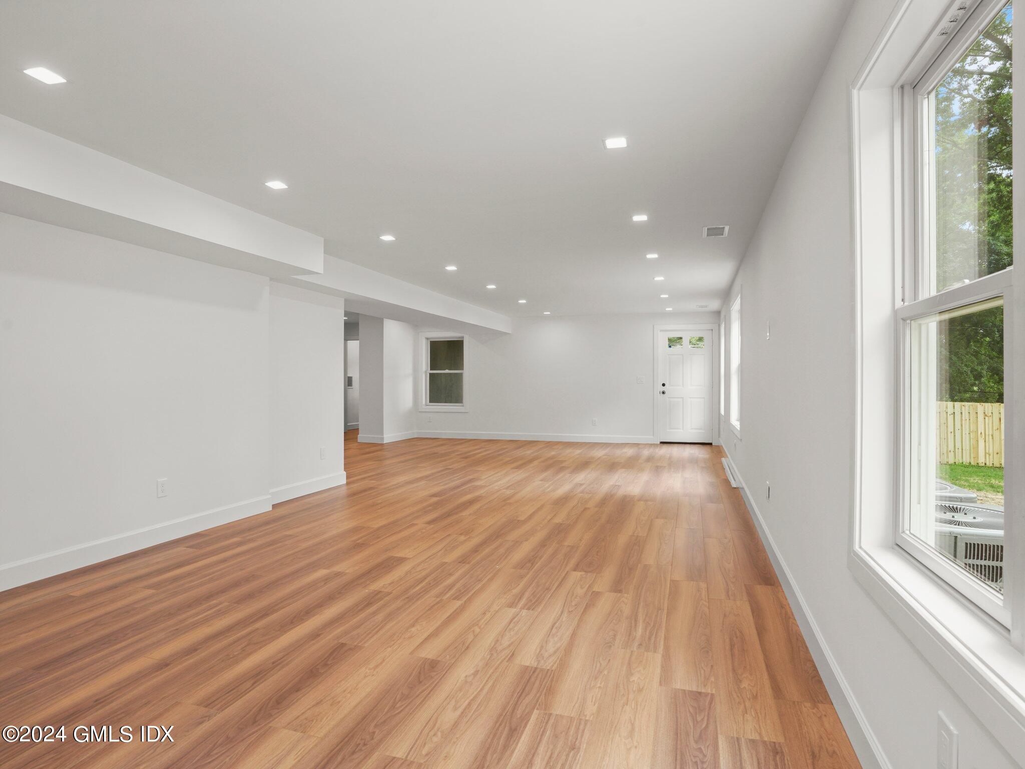 14 Rockland Place Greenwich, CT 06831 - Photo 46 of 54 a view of an empty room with wooden floor and a window