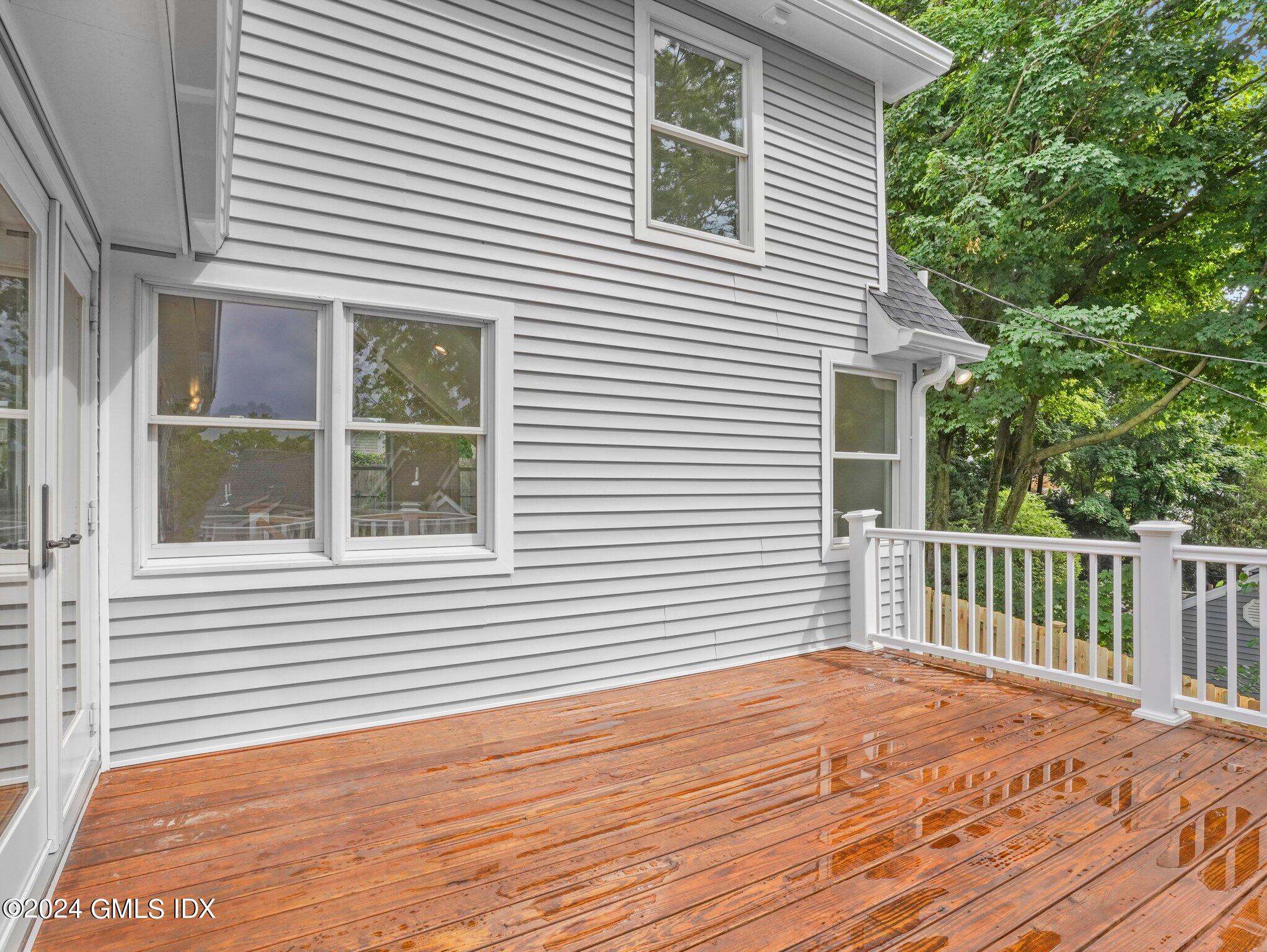 14 Rockland Place Greenwich, CT 06831 - Photo 48 of 54 a view of a house with wooden deck