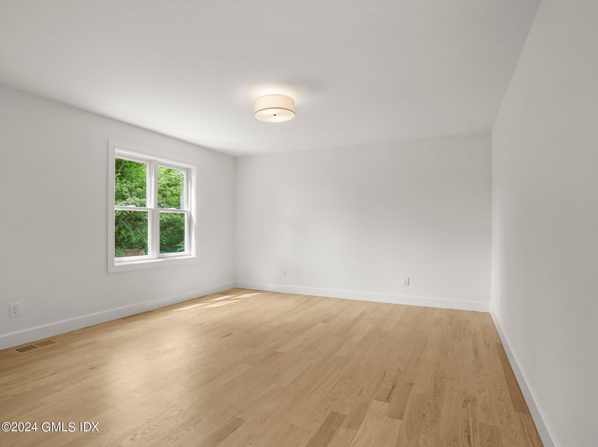 14 Rockland Place Greenwich, CT 06831 - Photo 7 of 54 an empty room with a window