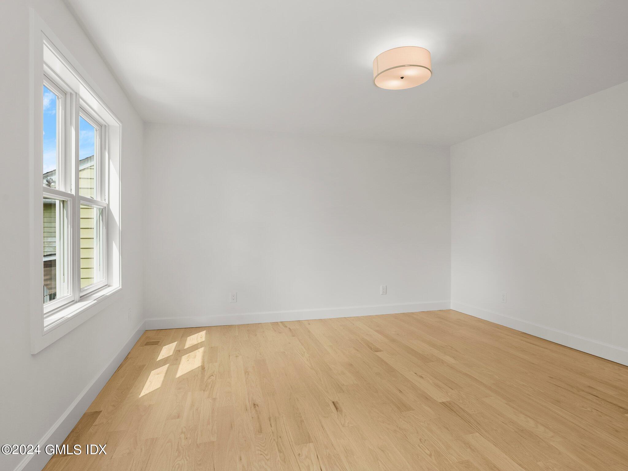 14 Rockland Place Greenwich, CT 06831 - Photo 8 of 54 a view of empty room with windows