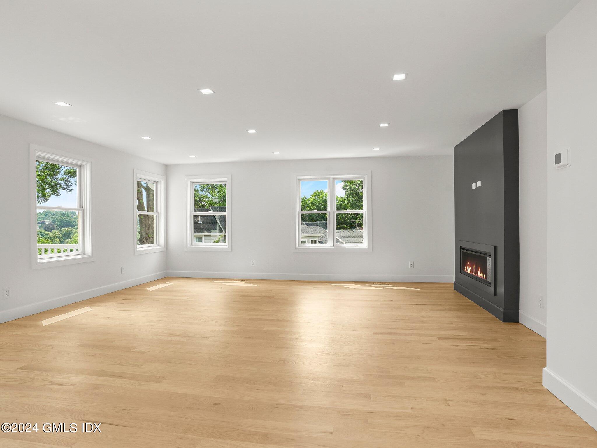 14 Rockland Place Greenwich, CT 06831 - Photo 10 of 54 an empty room with windows and entrance