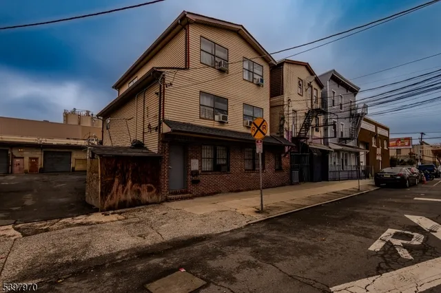 a view of a house with a street