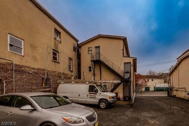 a view of a cars park in front of house