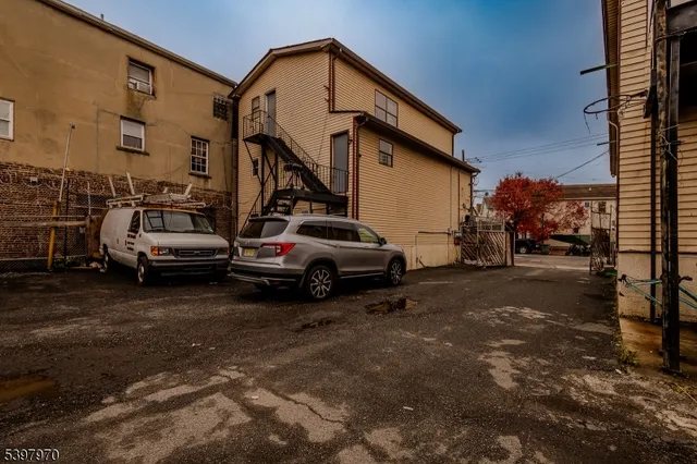 a view of a car park in front of house
