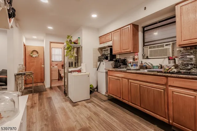 a kitchen with stainless steel appliances a refrigerator sink and cabinets