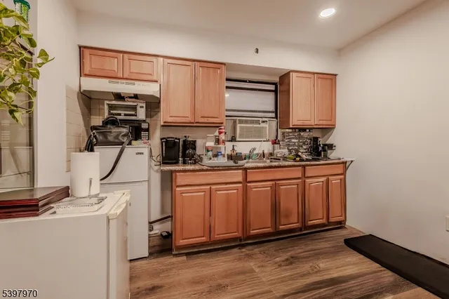 a kitchen with stainless steel appliances a sink and cabinets