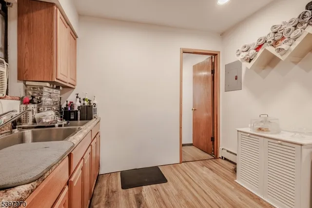 a kitchen with a sink and a refrigerator