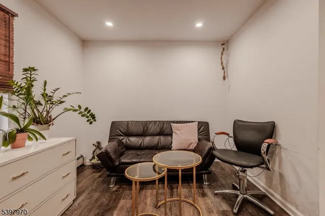 a work room with furniture and wooden floor