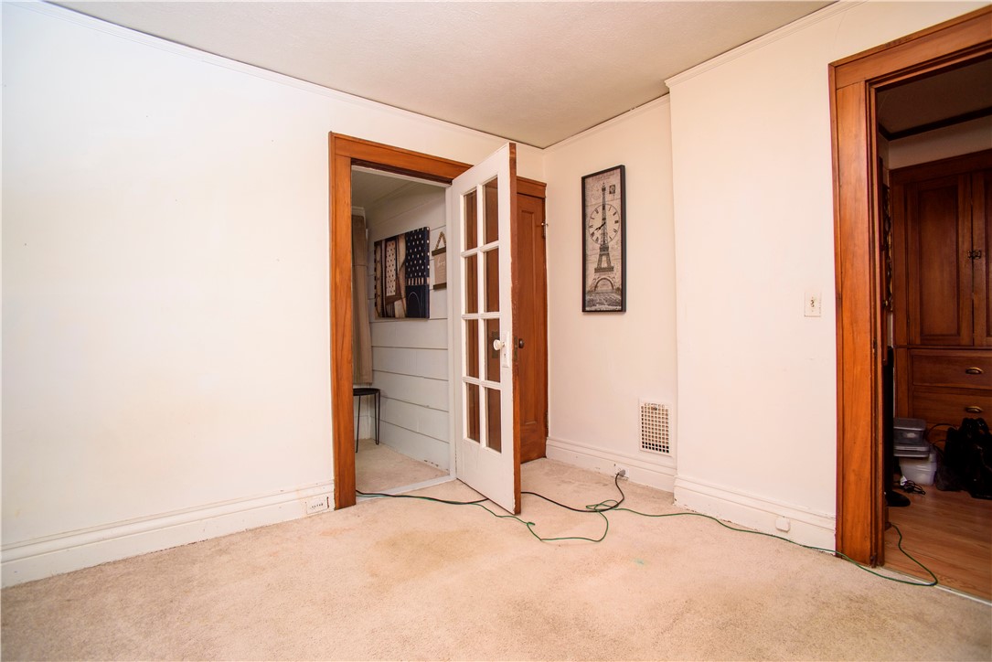 20 Raeburn Avenue Rochester, NY 14619 - Photo 16 of 23 Bedroom 2 with Office on back Porch