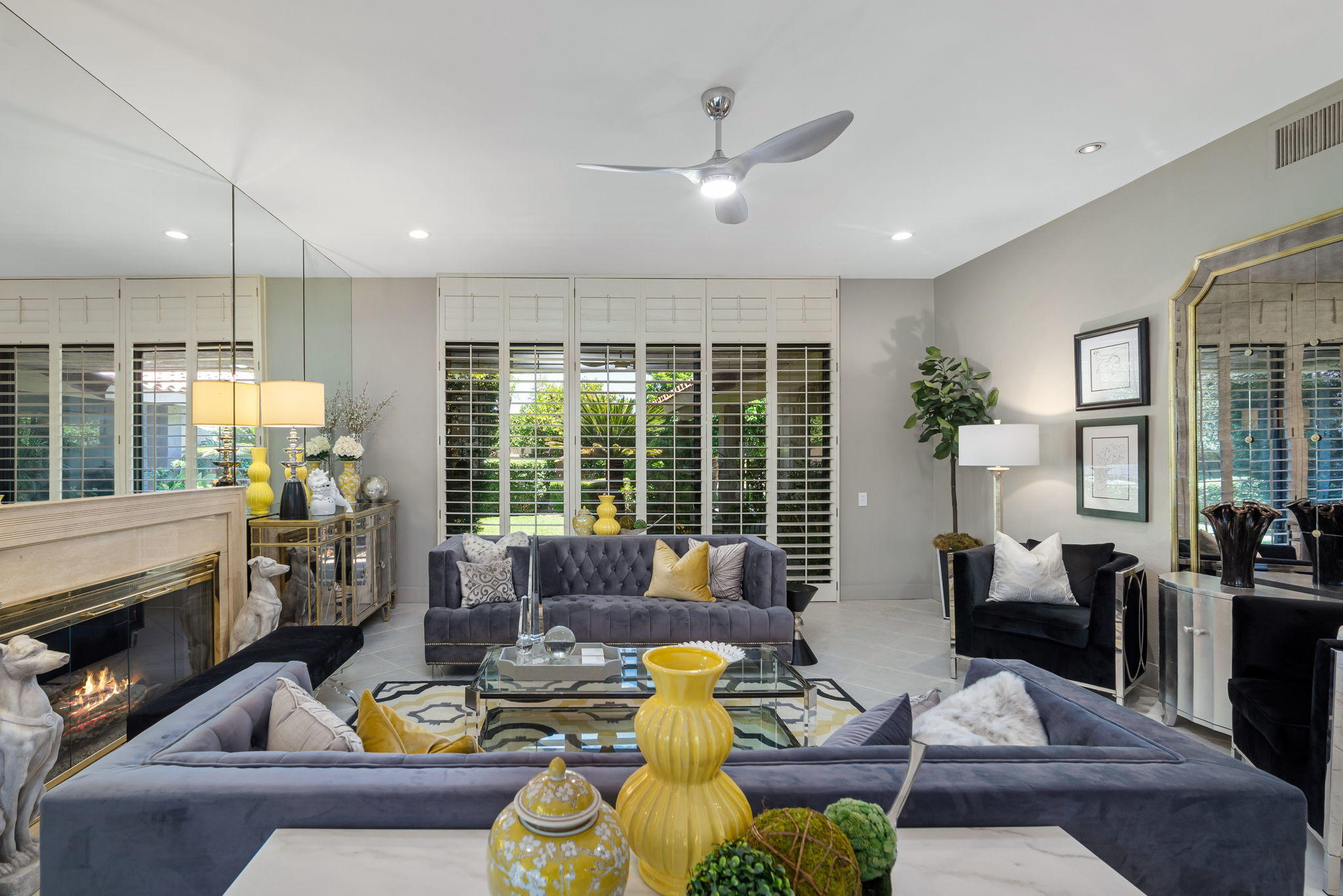 Undisclosed Address Rancho Mirage, CA 92270 - Photo 17 of 52 a living room with furniture fireplace and a large window