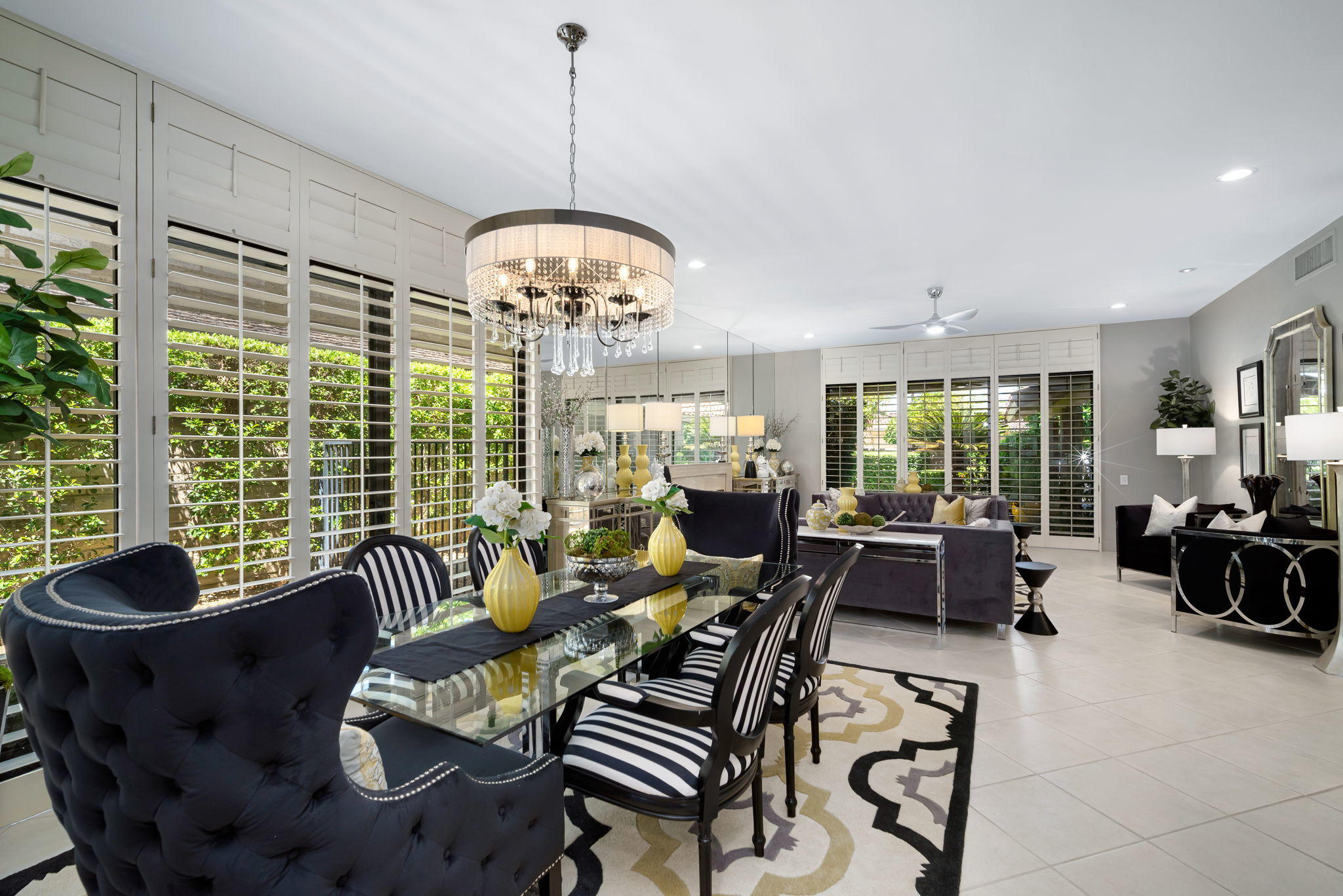 Undisclosed Address Rancho Mirage, CA 92270 - Photo 20 of 52 a living room with furniture chandelier and a large window