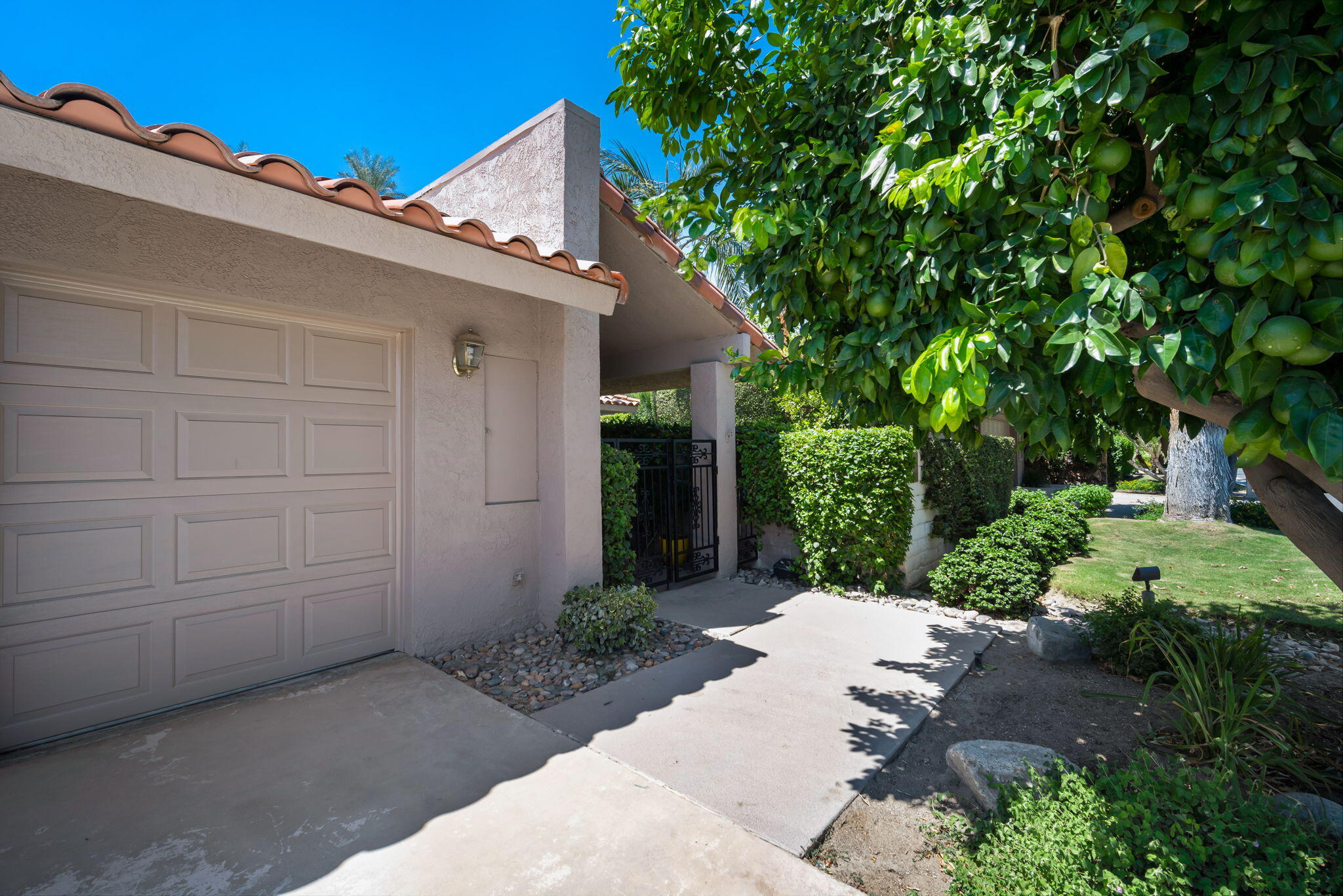 Undisclosed Address Rancho Mirage, CA 92270 - Photo 3 of 52 a view of a house with a yard