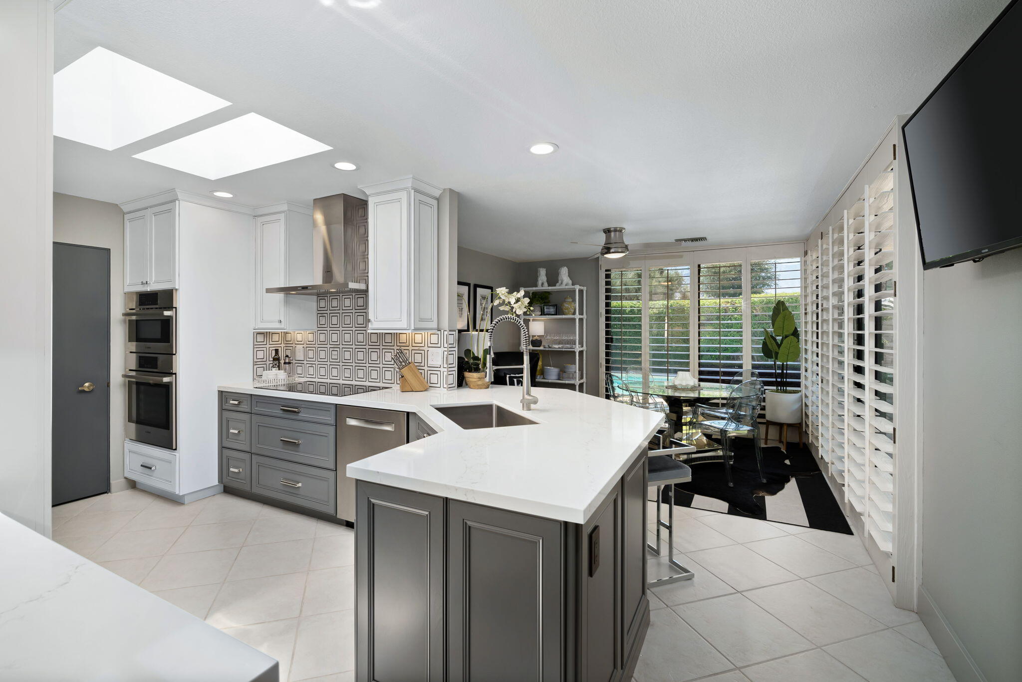 Undisclosed Address Rancho Mirage, CA 92270 - Photo 22 of 52 a kitchen with a sink stove and cabinets