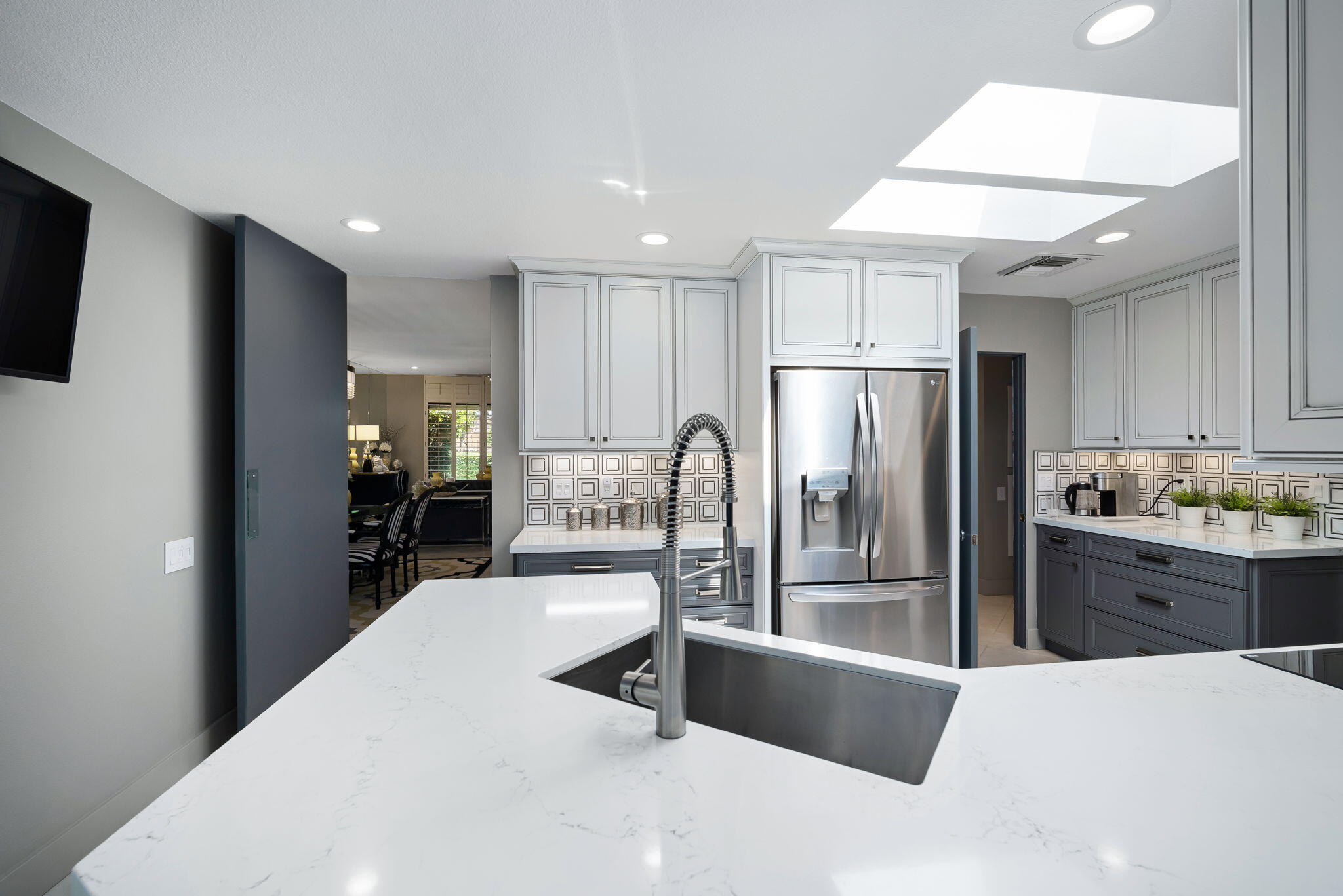 Undisclosed Address Rancho Mirage, CA 92270 - Photo 23 of 52 a kitchen with stainless steel appliances kitchen island granite countertop a refrigerator a sink a stove and oven