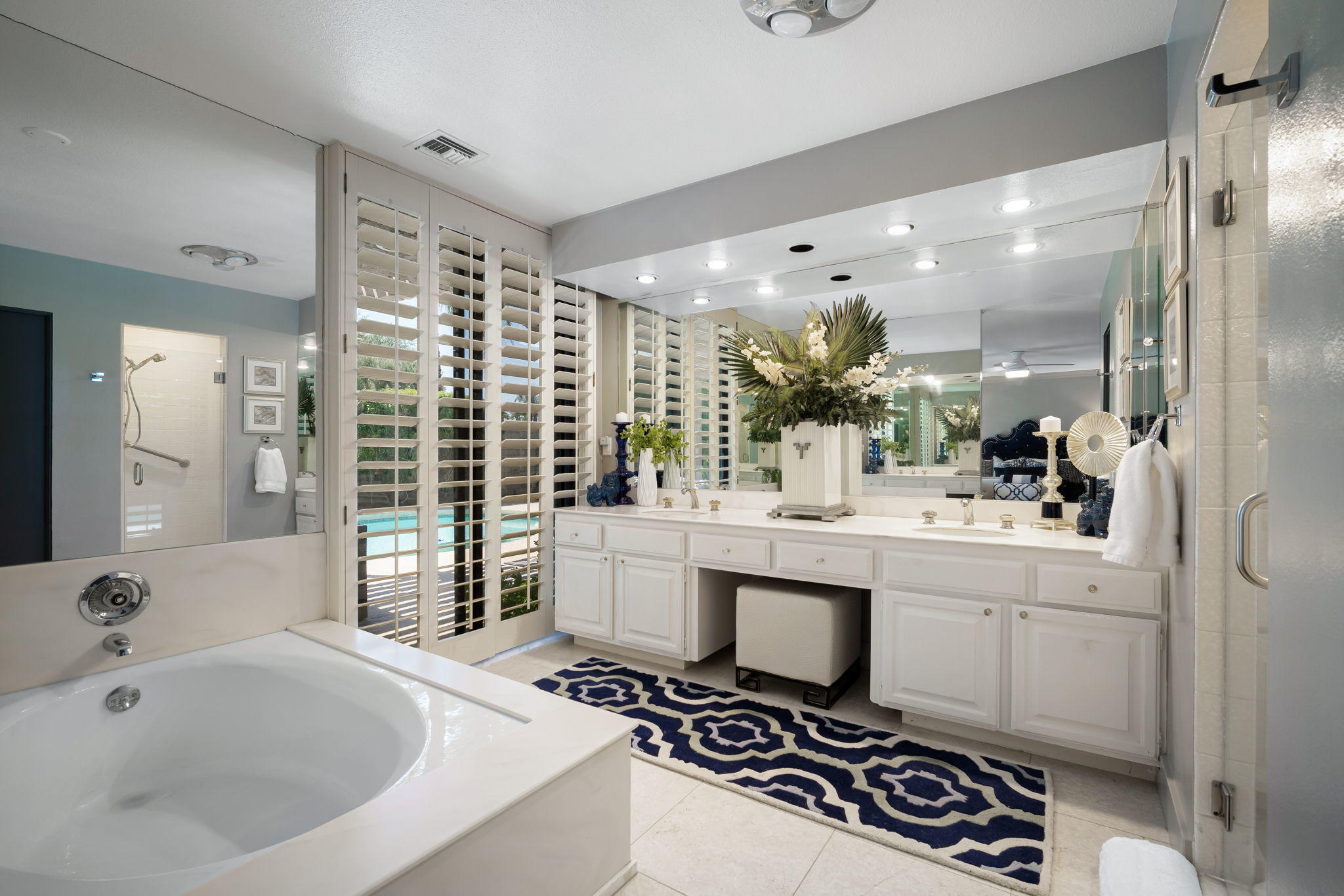 Undisclosed Address Rancho Mirage, CA 92270 - Photo 32 of 52 a bathroom with a sink mirror and a bathtub