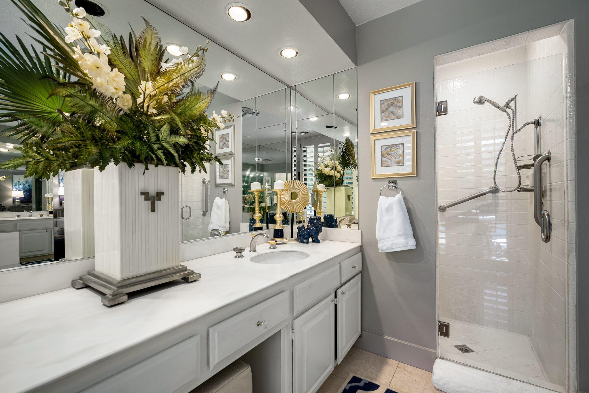 Undisclosed Address Rancho Mirage, CA 92270 - Photo 34 of 52 a bathroom with a sink a mirror and a shower
