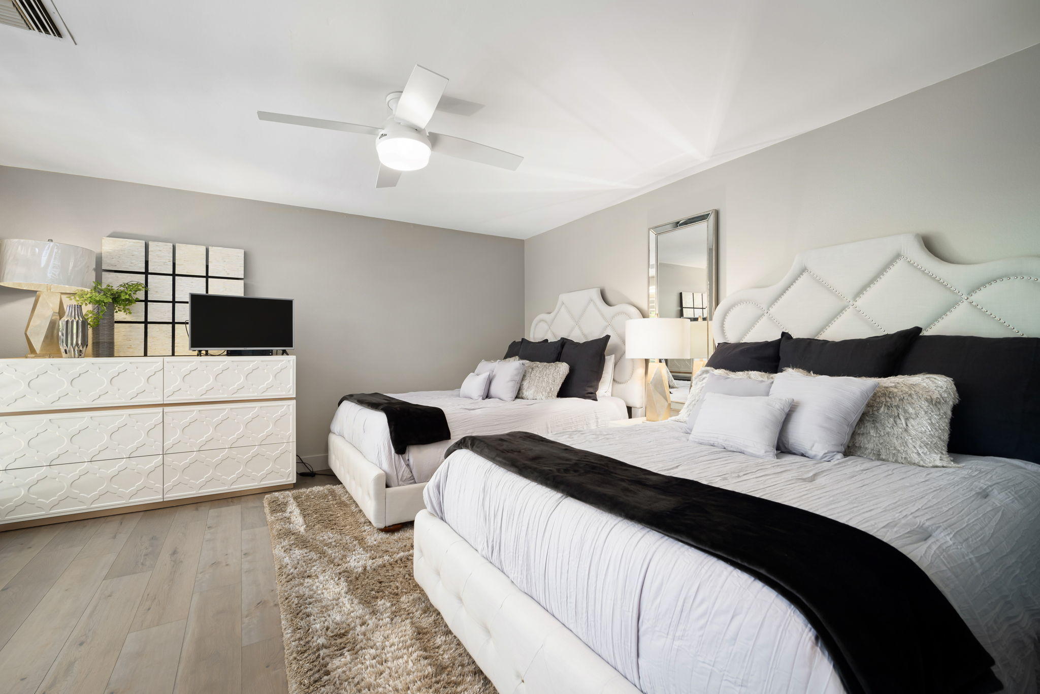 Undisclosed Address Rancho Mirage, CA 92270 - Photo 35 of 52 a bedroom with two beds and a night stand