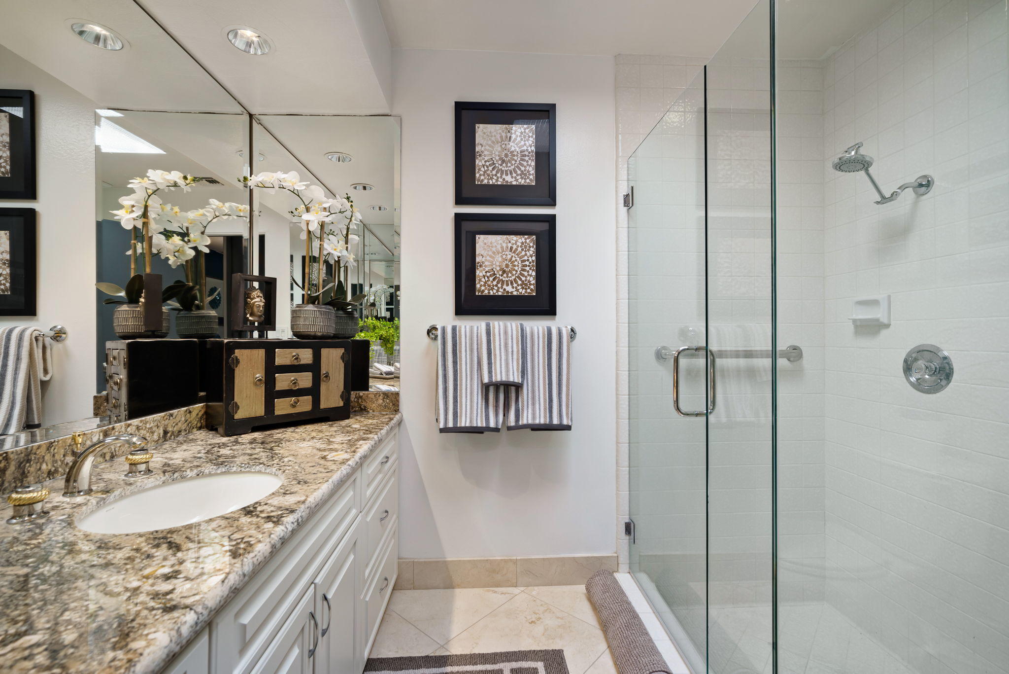 Undisclosed Address Rancho Mirage, CA 92270 - Photo 36 of 52 a bathroom with a granite countertop sink a mirror and shower
