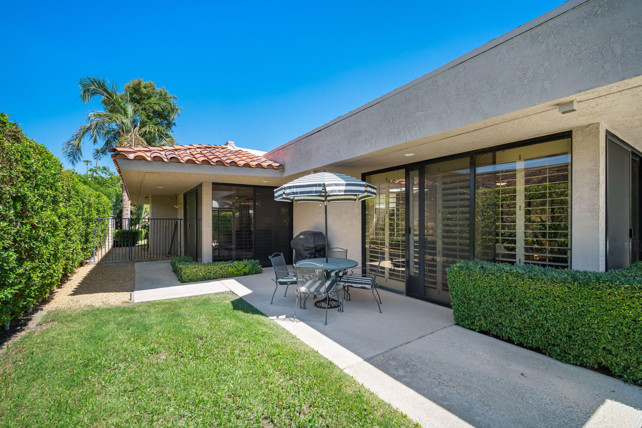 Undisclosed Address Rancho Mirage, CA 92270 - Photo 43 of 52 a view of a chair and table in backyard of the house